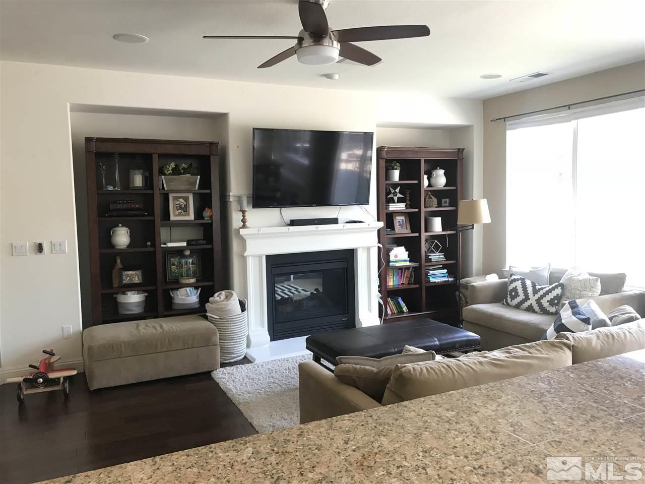 615 Equine Court Reno, NV 89521 - Photo 7 of 25 a living room with furniture fireplace and flat screen tv