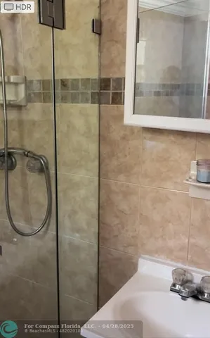 a bathroom with a sink and a shower