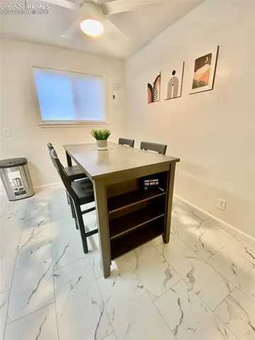 a view of kitchen with furniture and wooden floor