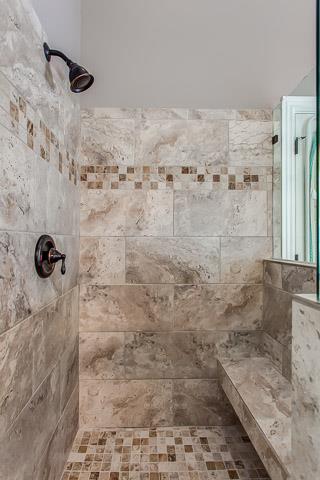 232 Chester Stevens Road Franklin, TN 37067 - Photo 13 of 20 SPACIOUS SEPARATE SHOWER W/OIL RUBBED BRONZE FIXTURES, CUSTOM TILE & THE FRAMELESS GLASS ENCLOSURE AND A BUILT-IN BENCH!