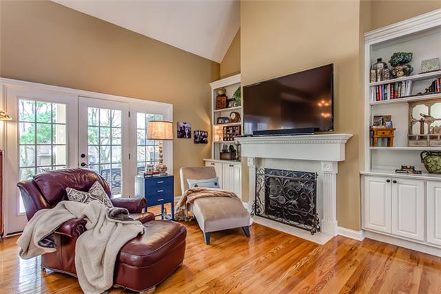 232 Chester Stevens Road Franklin, TN 37067 - Photo 6 of 20 BUILT-IN BOOKCASES, GAS LOG FIREPLACE, & 2 DOORS TO ACCESS THE REAR SPACES! CHOOSE TO WALL MOUNT A FLATSCREEN OR ACCENTUATE W/ART -- EITHER PREFERENCE IS EASILY ACCOMODATED IN THIS ROOM! AND THERE'S AN ADDITIONAL BUILT-IN BOOKCASE AS WELL...
