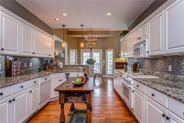 232 Chester Stevens Road Franklin, TN 37067 - Photo 8 of 20 TAKE A LOOK AT ALL OF THIS GRANITE COUNTER SPACE AS IF THE ROOM DOESN'T END! AMPLE CABINET SPACE AS WELL & A PANTRY OFF OF THE LAUNDRY ROOM NOT TO BE BELIEVED! THERE IS EVEN SPACE FOR A SLEEK ISLAND IN THE MIDDLE. THIS ONE DOES NOT CONVEY...