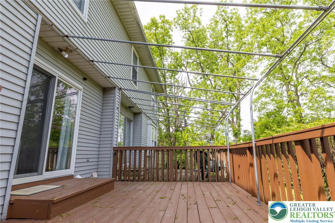896 Briarstone Road Bethlehem, PA 18017 - Photo 23 of 26 a balcony with wooden floor and fence