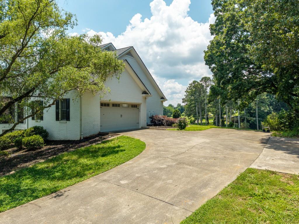 774 Bray Road Southwest Calhoun, GA 30701 - Photo 75 of 106 a view of a house with a yard and garage