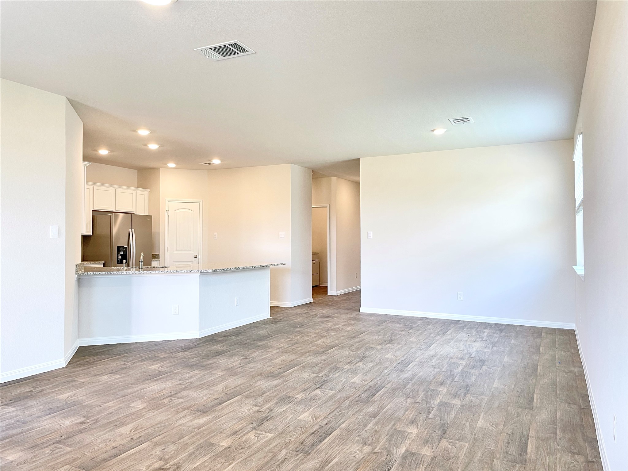 467 Evergreen Sumac Loop Kyle, TX 78640 - Photo 18 of 40 a view of kitchen with stainless steel appliances a refrigerator and a microwave
