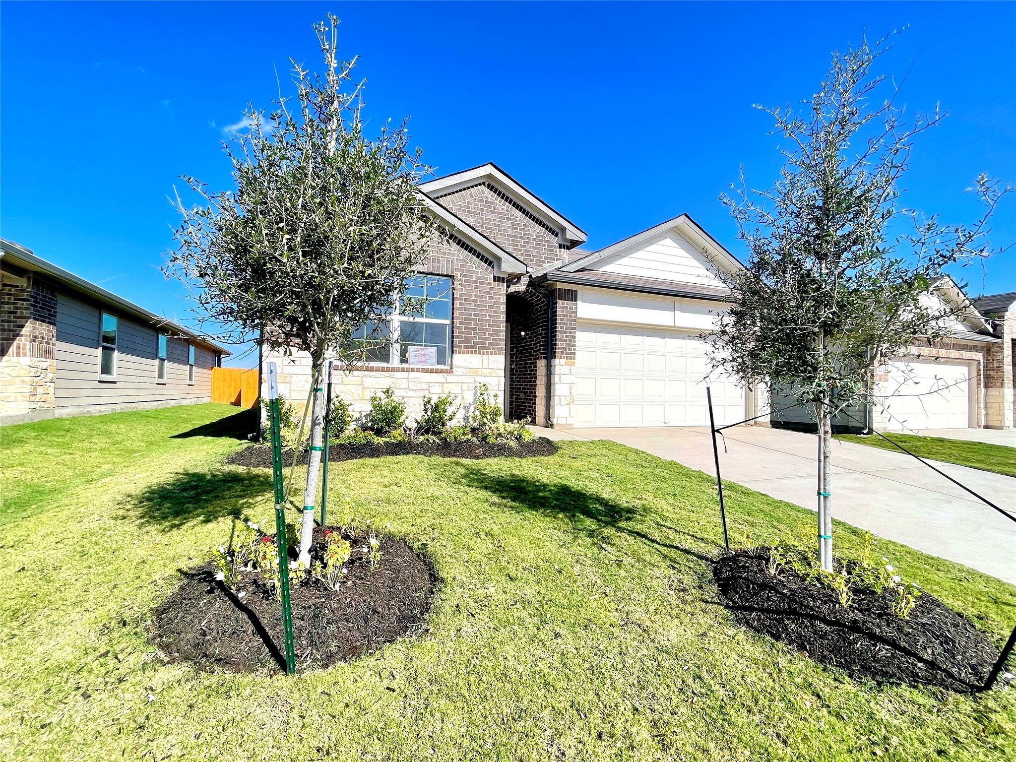 467 Evergreen Sumac Loop Kyle, TX 78640 - Photo 2 of 40 a front view of house with yard and green space