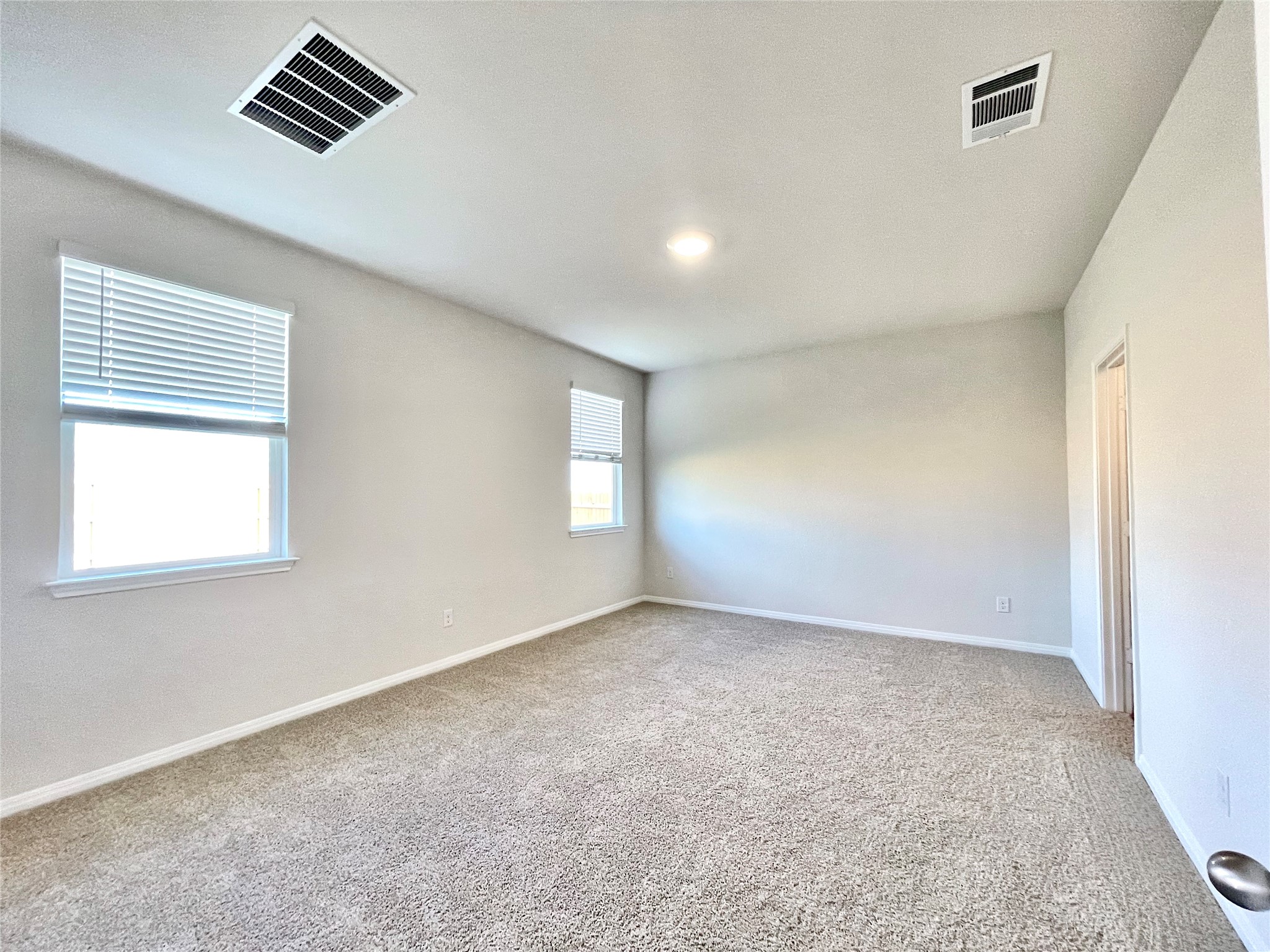 467 Evergreen Sumac Loop Kyle, TX 78640 - Photo 25 of 40 an empty room with windows and cabinet