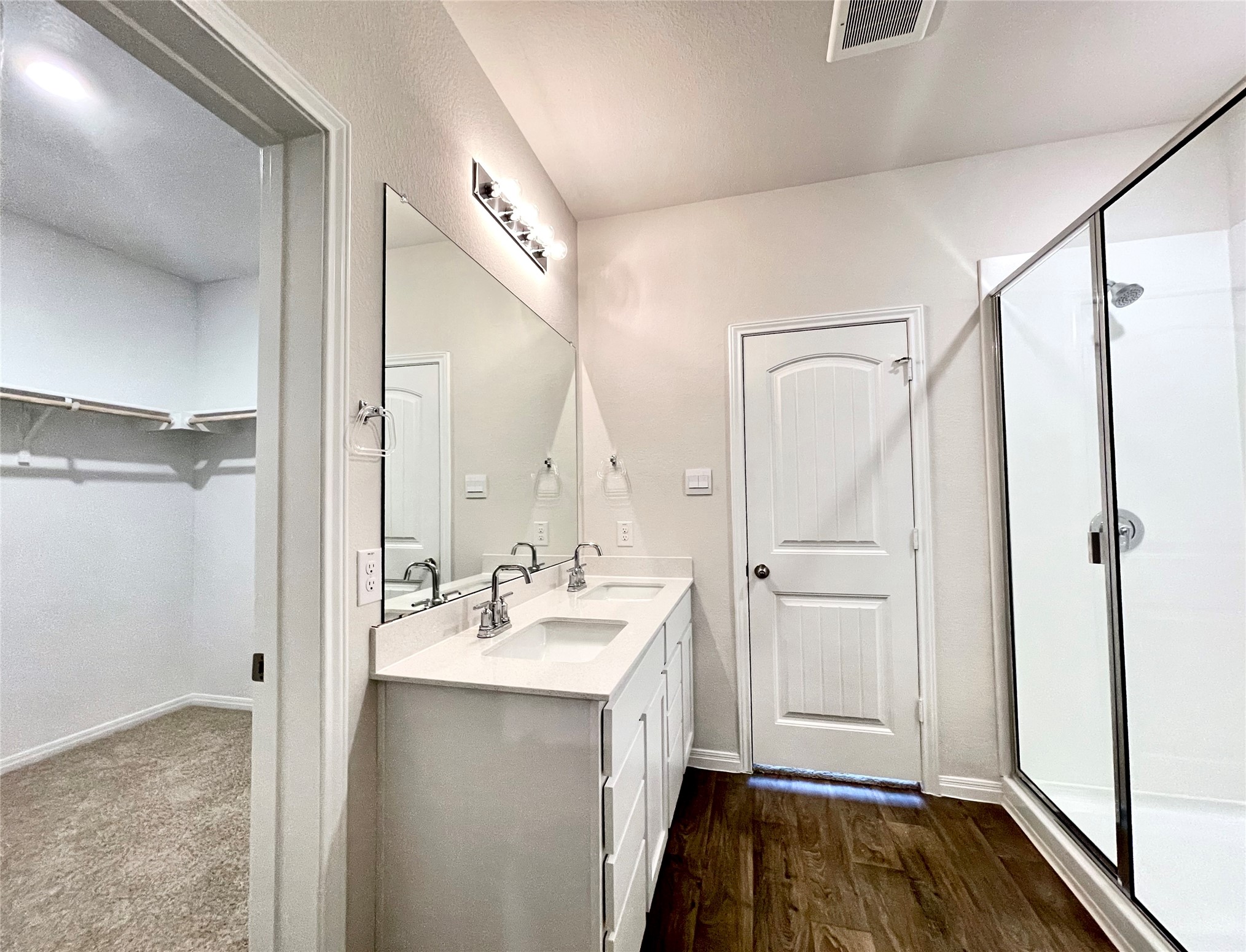 467 Evergreen Sumac Loop Kyle, TX 78640 - Photo 28 of 40 a bathroom with a double vanity sink and shower