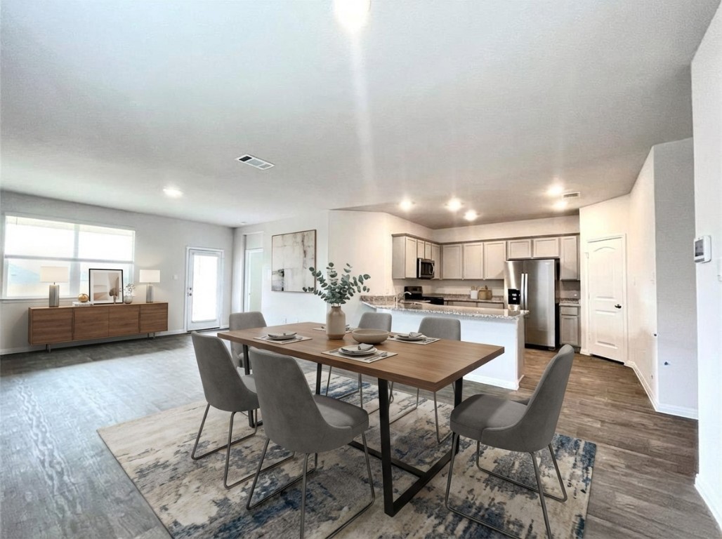 467 Evergreen Sumac Loop Kyle, TX 78640 - Photo 6 of 40 Dining space with dark wood finished floors and recessed lighting