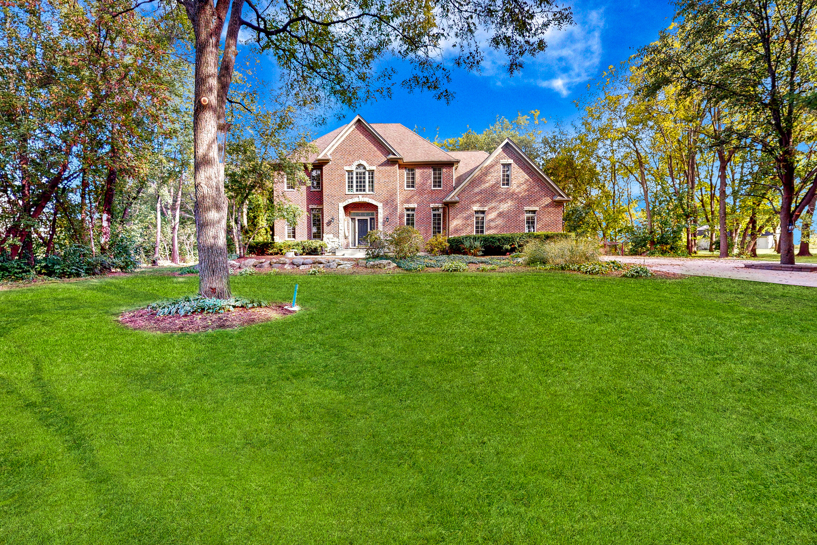 35W998 Miller Road Dundee, IL 60102 - Photo 1 of 33 a front view of a house with garden