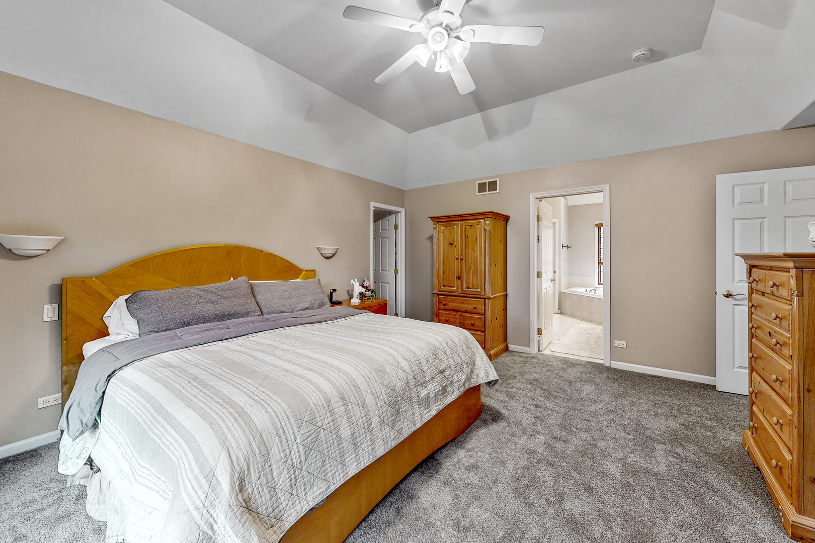 35W998 Miller Road Dundee, IL 60102 - Photo 18 of 33 a bedroom with a bed and a chandelier