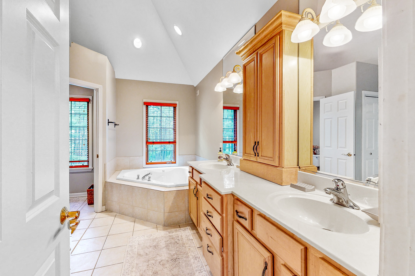 35W998 Miller Road Dundee, IL 60102 - Photo 20 of 33 a spacious bathroom with a double vanity sink mirror and bathtub