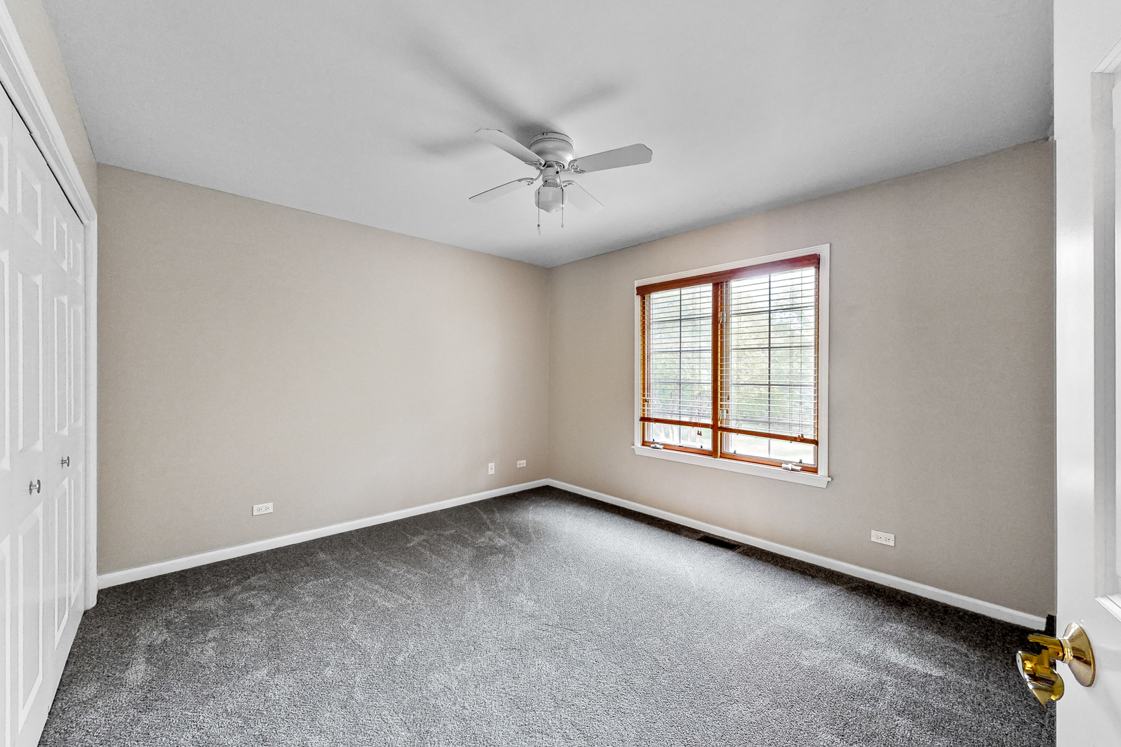 35W998 Miller Road Dundee, IL 60102 - Photo 24 of 33 an empty room with a window and a ceiling fan