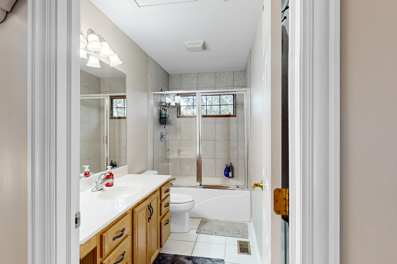 35W998 Miller Road Dundee, IL 60102 - Photo 26 of 33 a bathroom with a tub sink mirror and shower