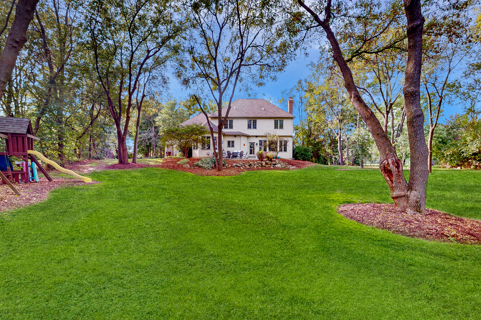35W998 Miller Road Dundee, IL 60102 - Photo 6 of 33 a view of a house with a big yard and large trees