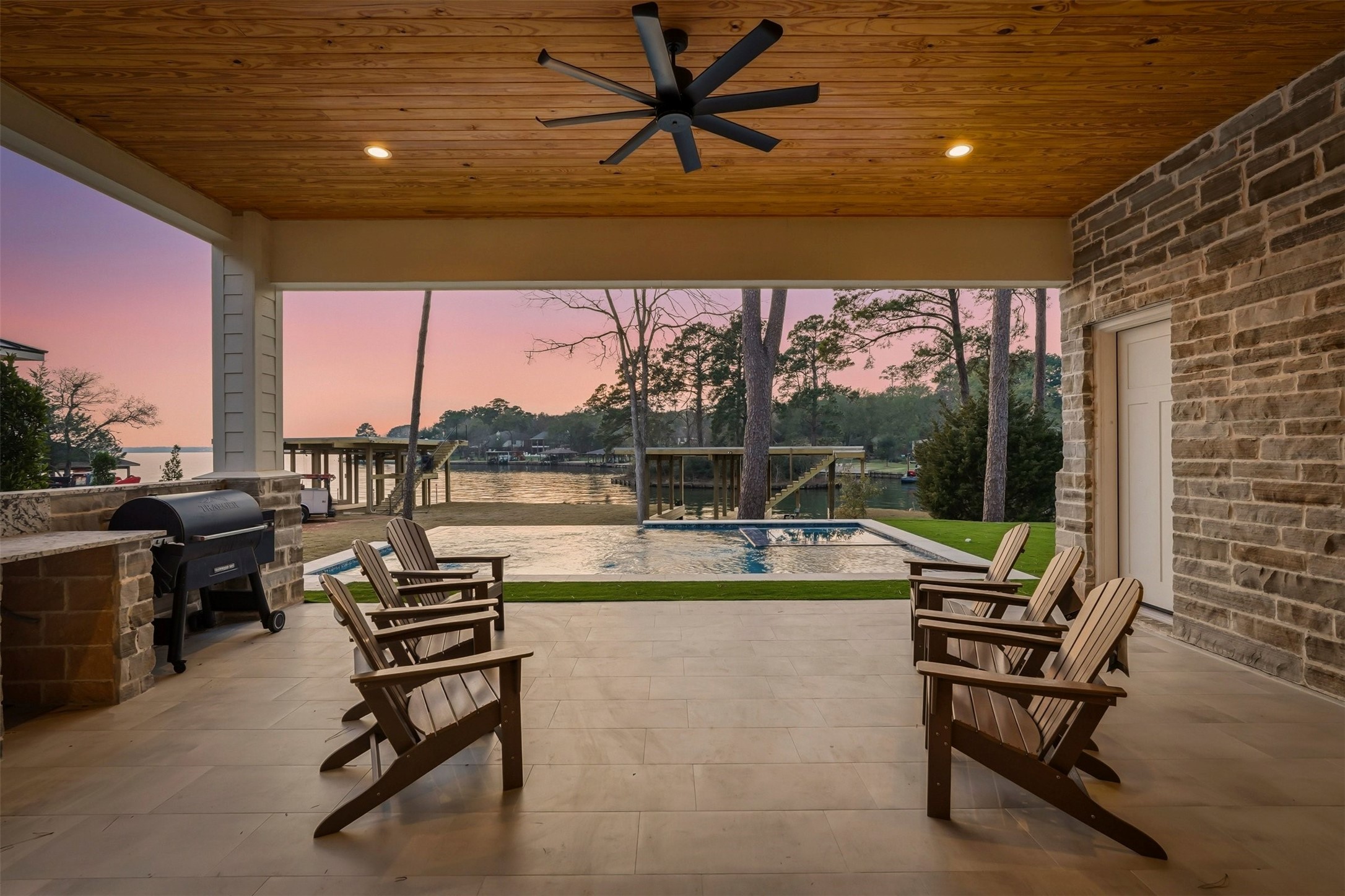 12833 Bruce Road Willis, TX 77318 - Photo 3 of 50 Covered Patio Overlooking Infinity Edge Pool and the Lake