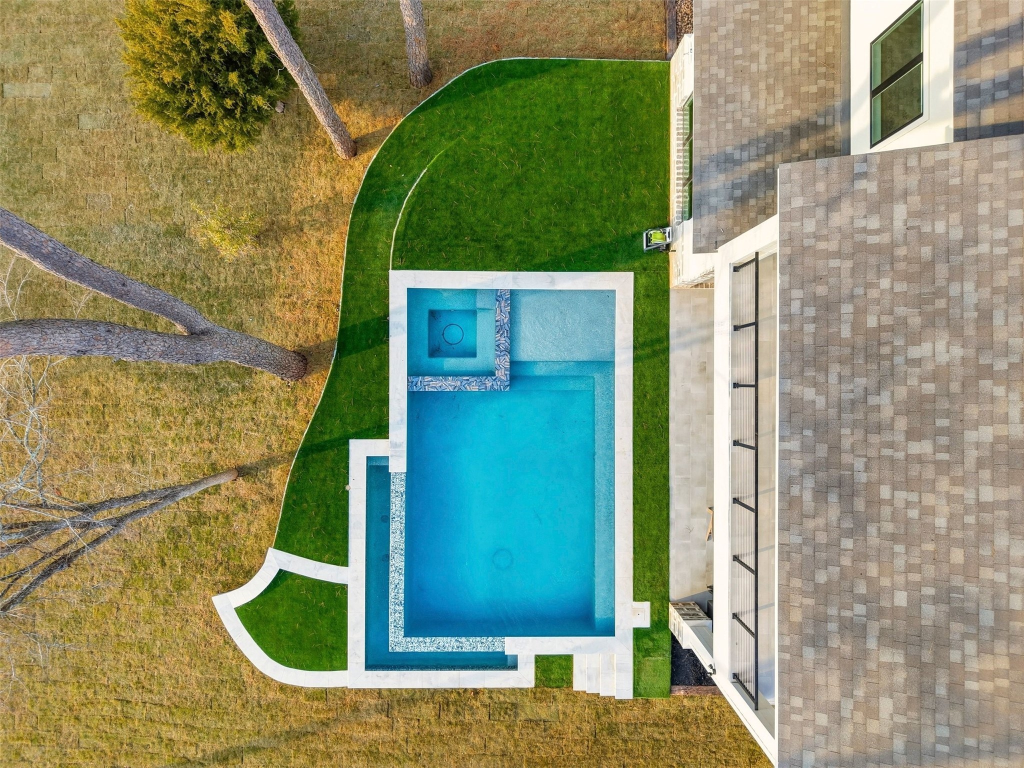 12833 Bruce Road Willis, TX 77318 - Photo 47 of 50 Infinity Edge Pool with Hot Tub and Turf Surrounds