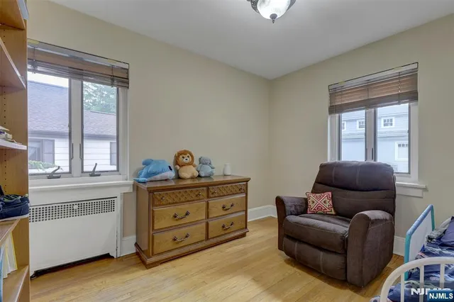a living room with furniture and windows