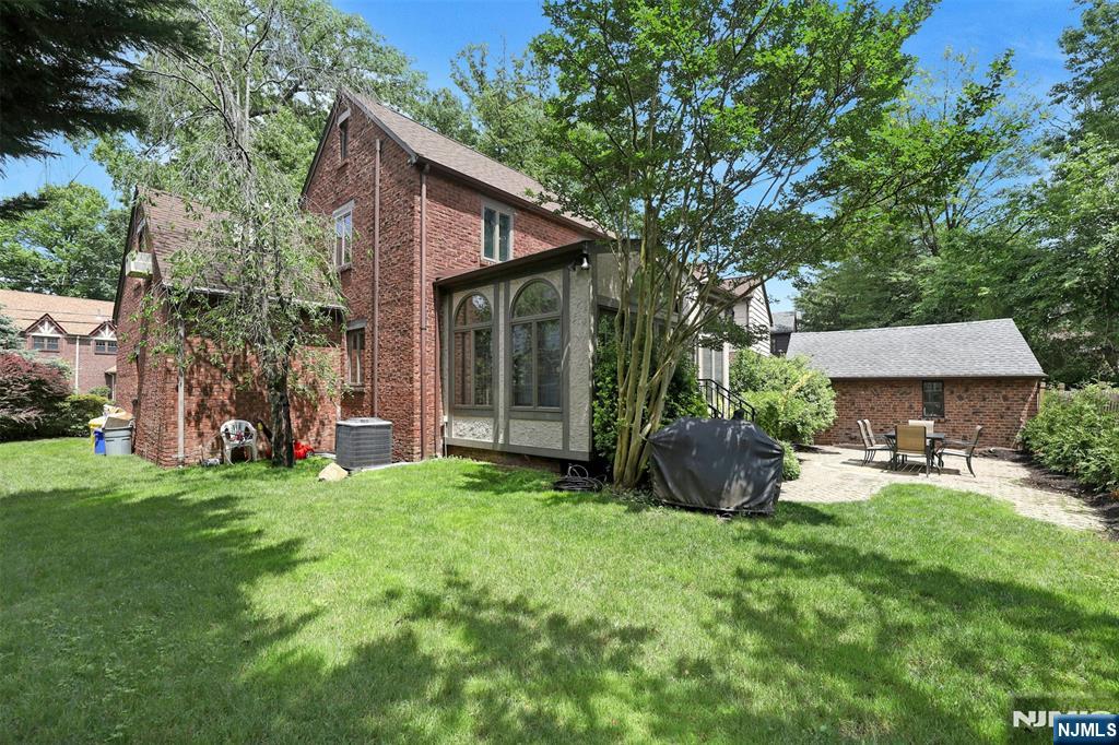 548 Standish Road Teaneck, NJ 07666 - Photo 26 of 28 a view of a house with backyard sitting area and garden