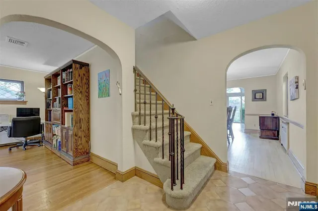 a view of a livingroom with furniture and workspace