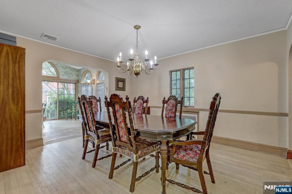548 Standish Road Teaneck, NJ 07666 - Photo 9 of 28 a view of a dining room with furniture and wooden floor