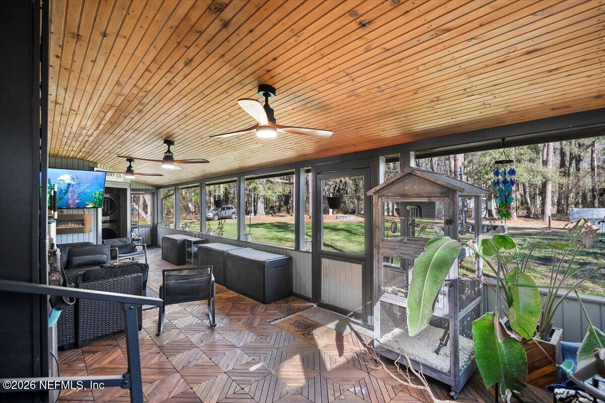 1917 Blair Road Jacksonville, FL 32221 - Photo 18 of 30 a patio with yard glass top table and chairs
