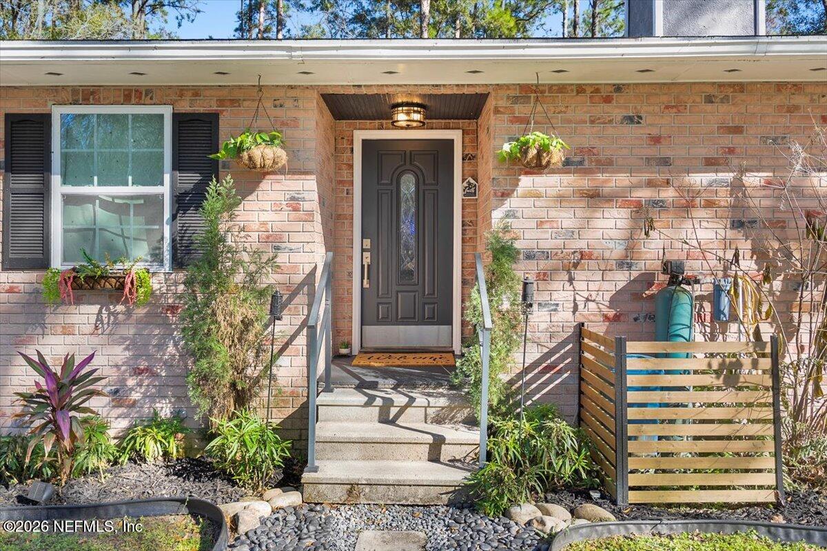 1917 Blair Road Jacksonville, FL 32221 - Photo 2 of 30 a front view of a house with a garden