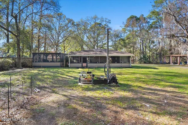 a view of outdoor space with table and chairs