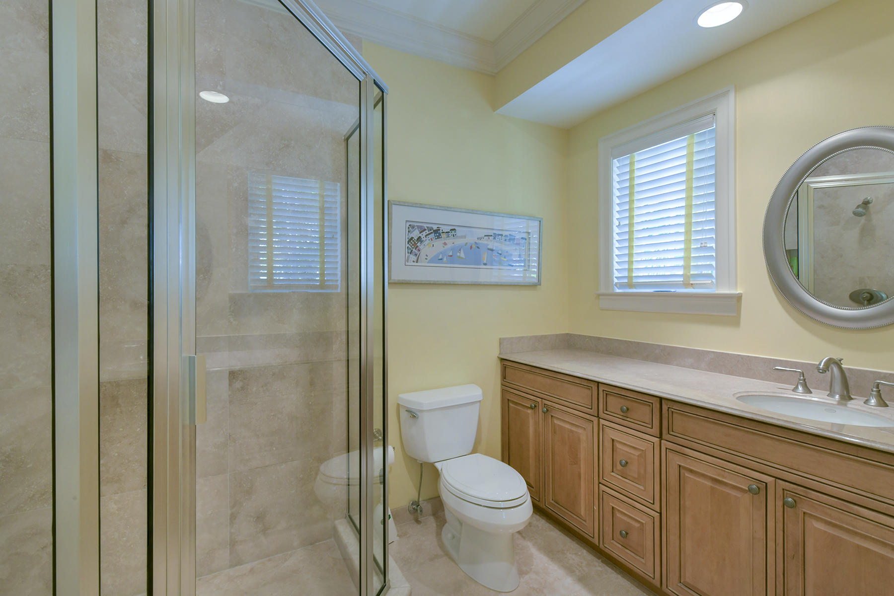 58 Sunset Key Drive Key West, FL 33040 - Photo 17 of 35 a bathroom with a granite countertop toilet a sink and a mirror
