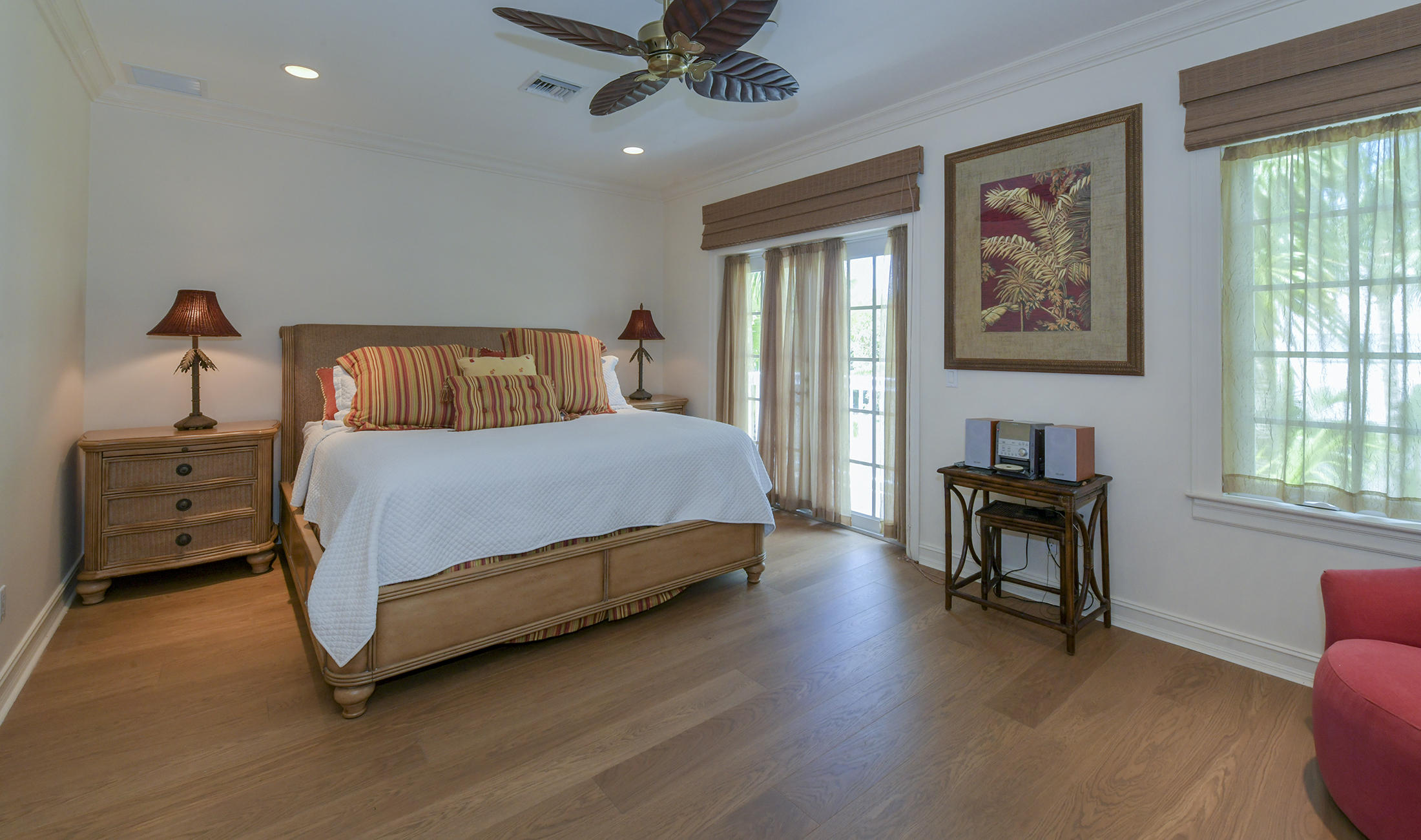 58 Sunset Key Drive Key West, FL 33040 - Photo 18 of 35 a bedroom with a bed and a chandelier
