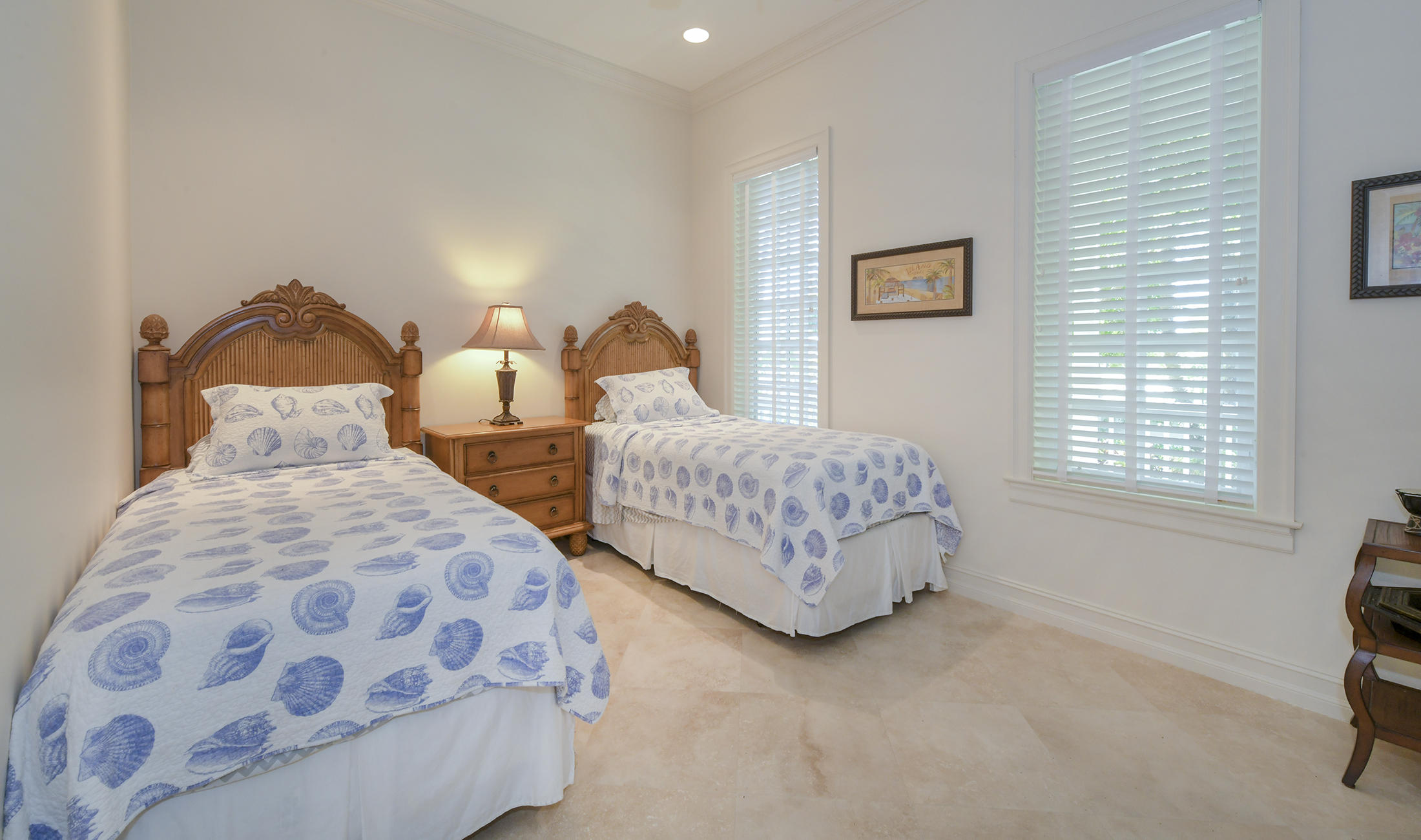 58 Sunset Key Drive Key West, FL 33040 - Photo 20 of 35 a bedroom with two beds and a window