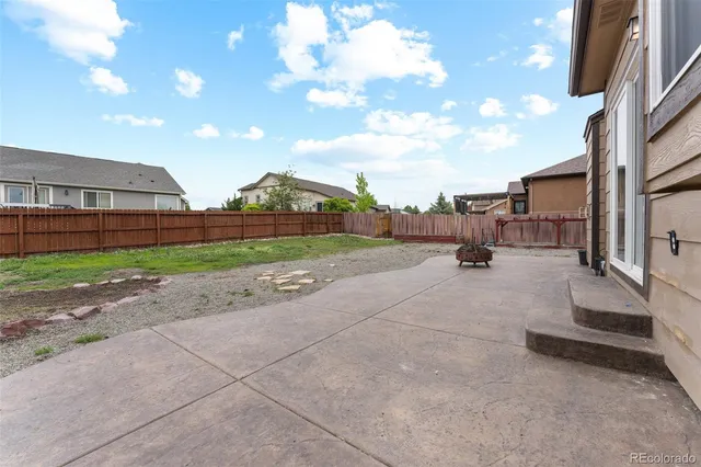 a view of a patio with a yard