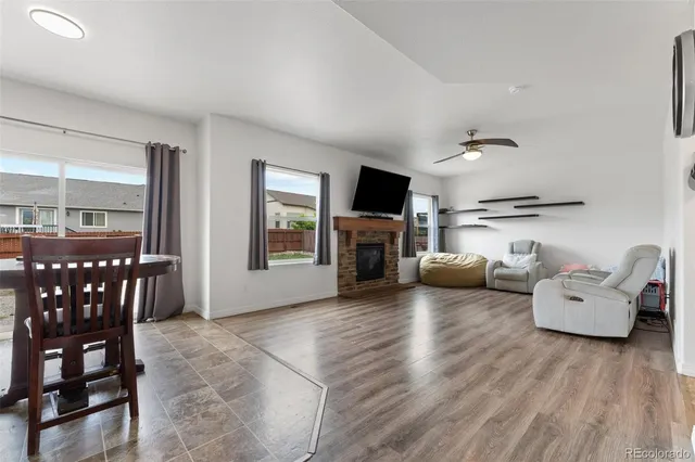 a living room with furniture and fireplace