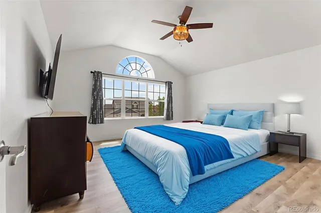 a bedroom with a large bed and a window