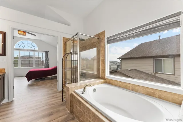 a bath tub sitting next to a window