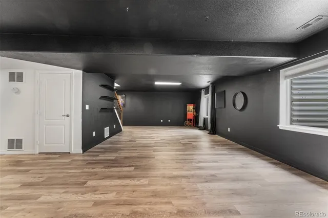 a view of a livingroom with a hall and a window