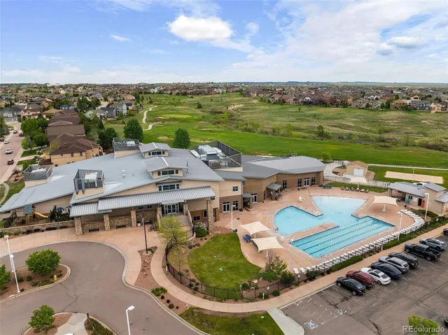 an aerial view of a house with outdoor space