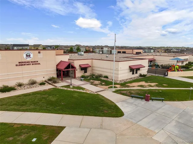 a view of a swimming pool and lounge chairs on th terrace