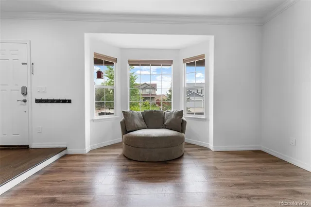 a living room with a couch and a window