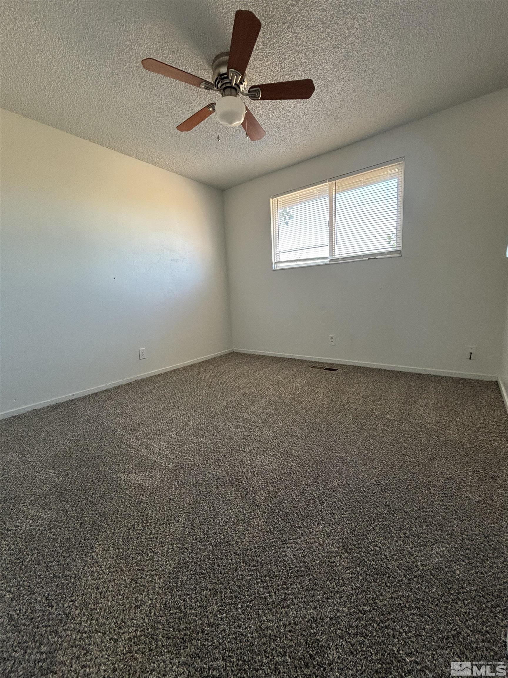 9405 Fremont Way Reno, NV 89506 - Photo 8 of 14 an empty room with a window