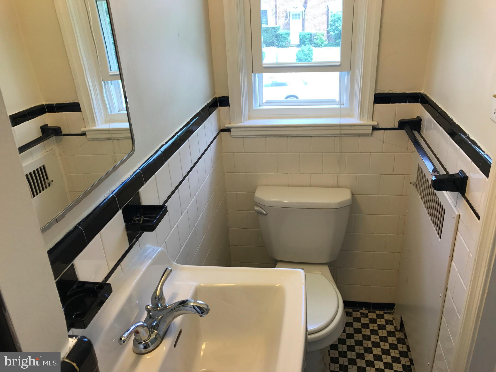1533 Northgate Road Baltimore, MD 21218 - Photo 15 of 18 a bathroom with a toilet and a sink