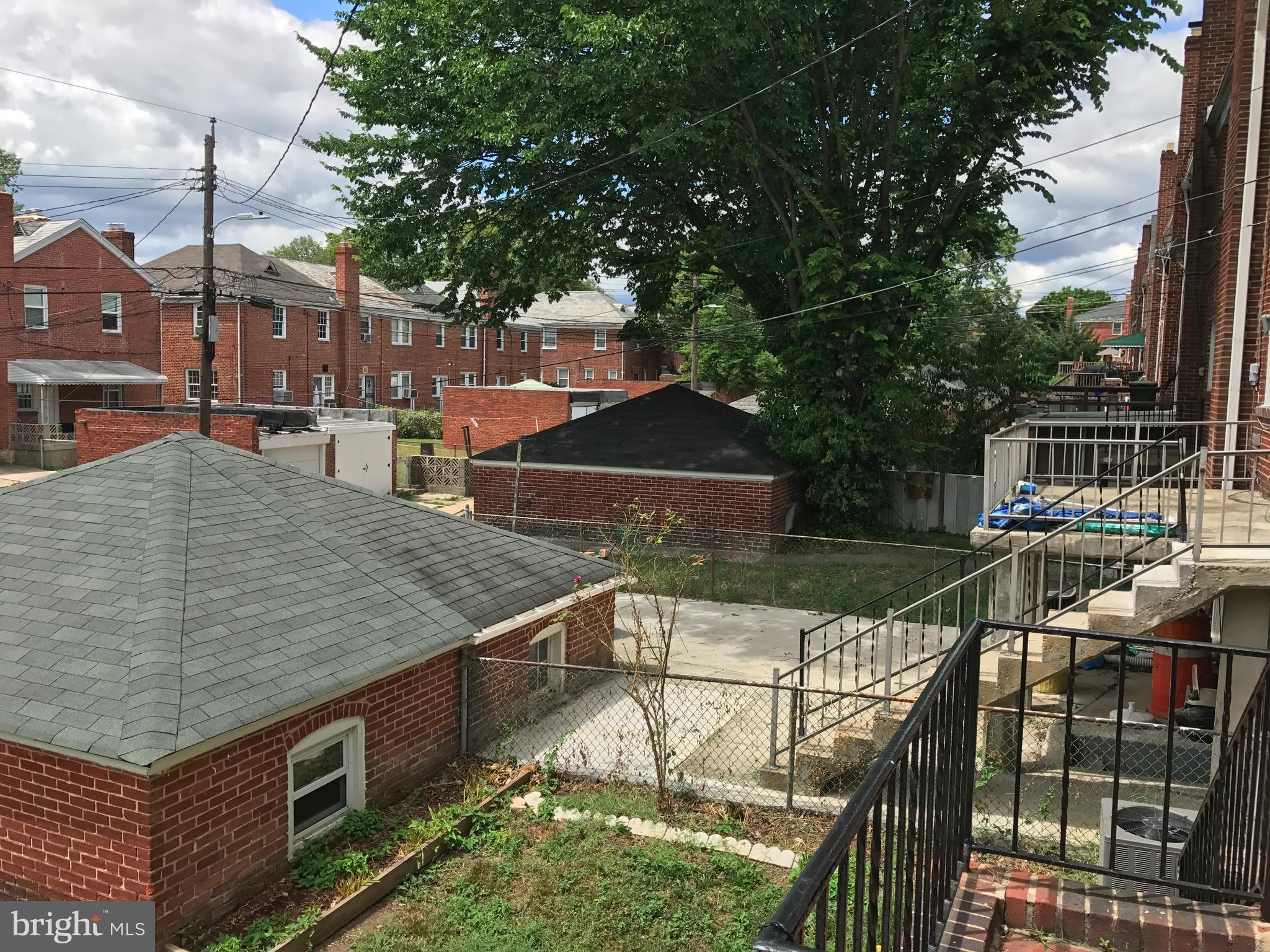 1533 Northgate Road Baltimore, MD 21218 - Photo 18 of 18 a view of a balcony with two chairs and a table