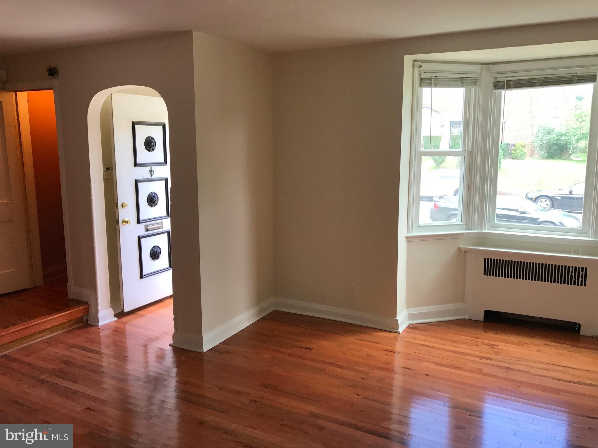 1533 Northgate Road Baltimore, MD 21218 - Photo 6 of 18 a view of an entryway with wooden floor