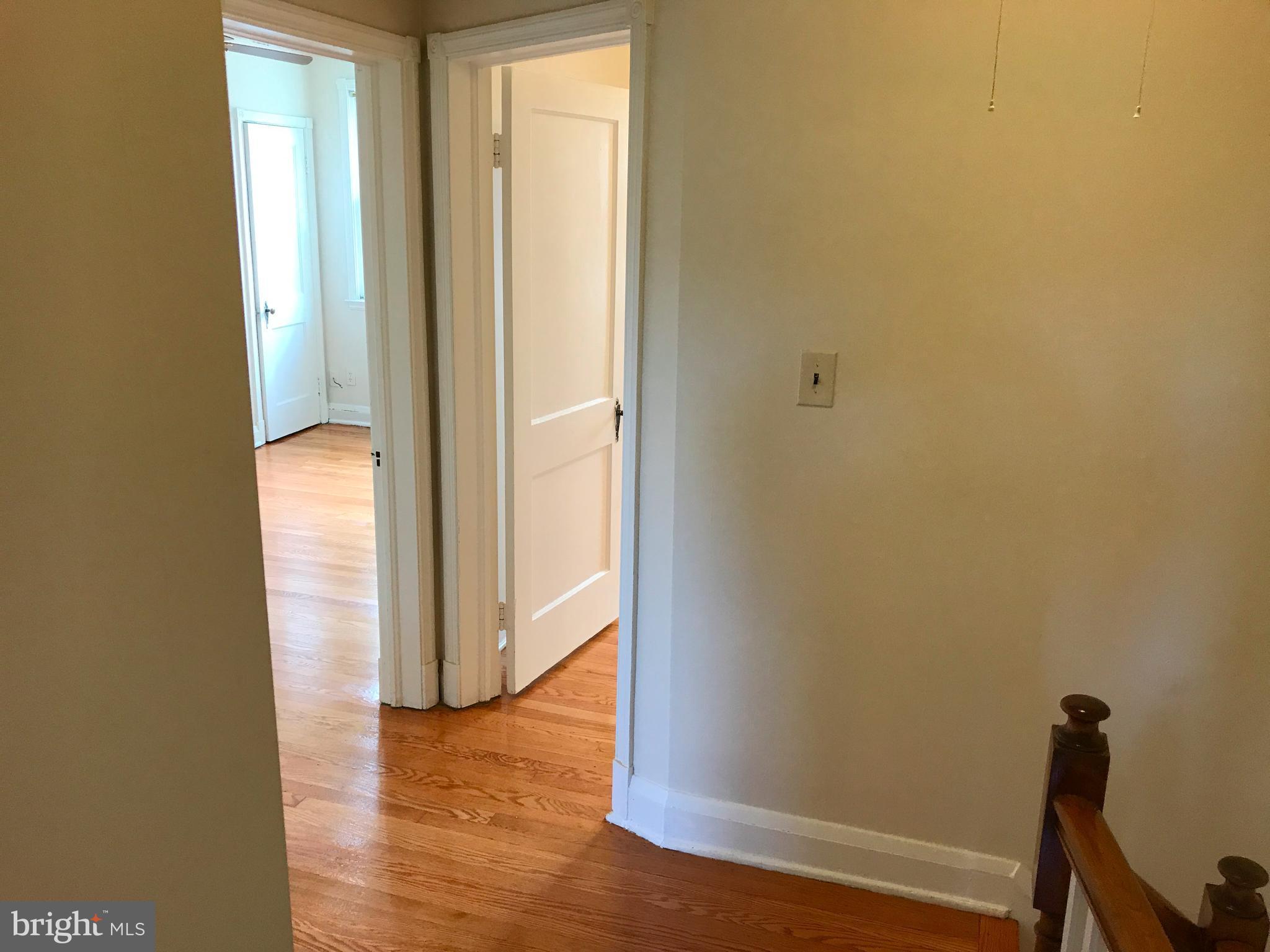 1533 Northgate Road Baltimore, MD 21218 - Photo 10 of 18 a view of a hallway with wooden floor
