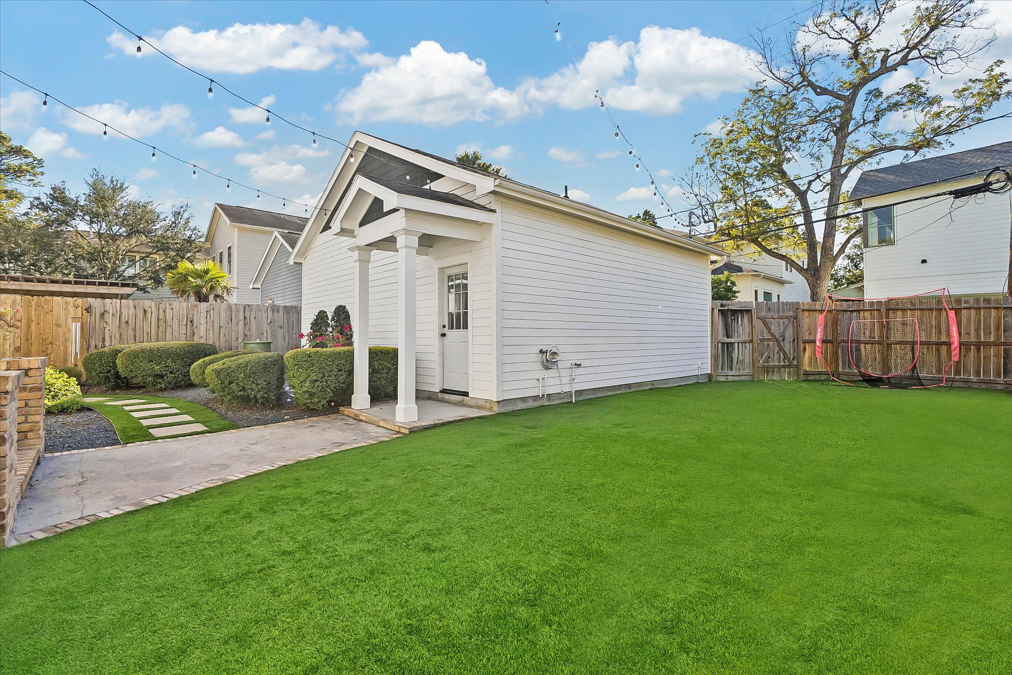 1127 Tulane Street Houston, TX 77008 - Photo 7 of 22 a view of a backyard with plants and a large tree