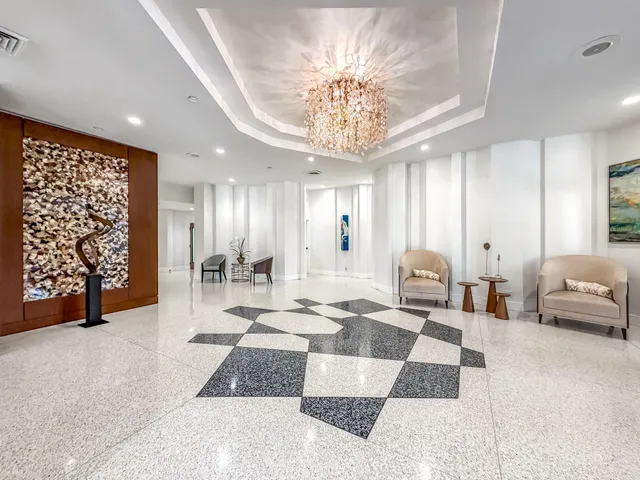 a view of a dining room with furniture wooden floor and chandelier