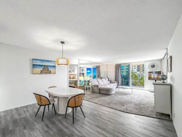 a kitchen with a stove a sink and a refrigerator