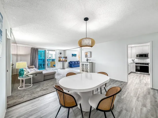 a kitchen with stainless steel appliances granite countertop a sink a stove a microwave and cabinets