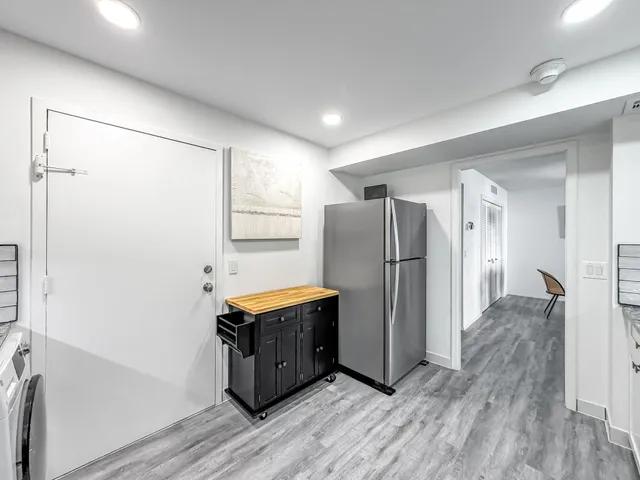 a bed room with furniture and a table