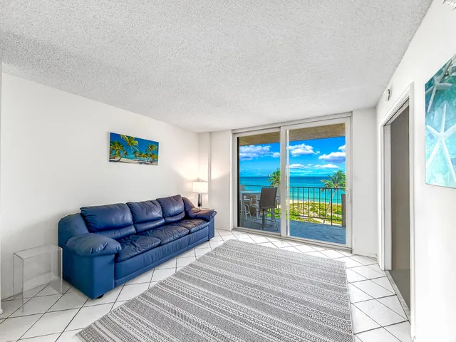 a view of swimming pool with outdoor seating and city view